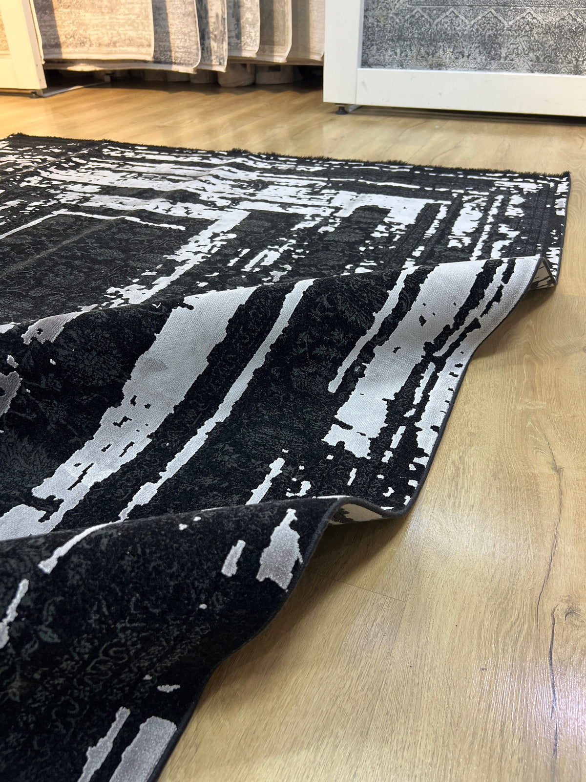 7x10 Ft Black Ethnic Distressed Bamboo Rug with Gray Modern Lines