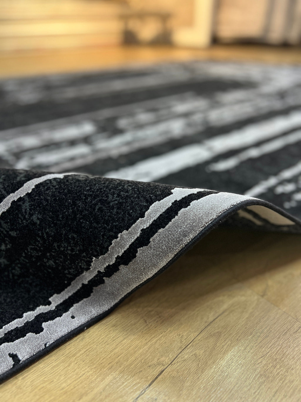 7x10 Ft Black Ethnic Distressed Bamboo Rug with Gray Modern Lines