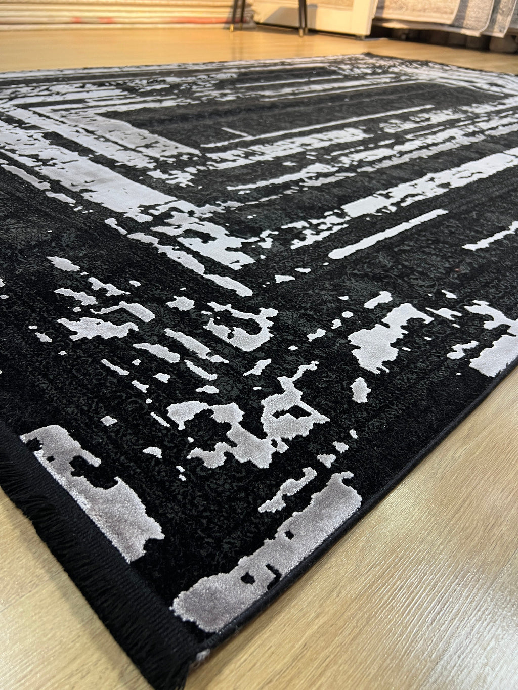 7x10 Ft Black Ethnic Distressed Bamboo Rug with Gray Modern Lines