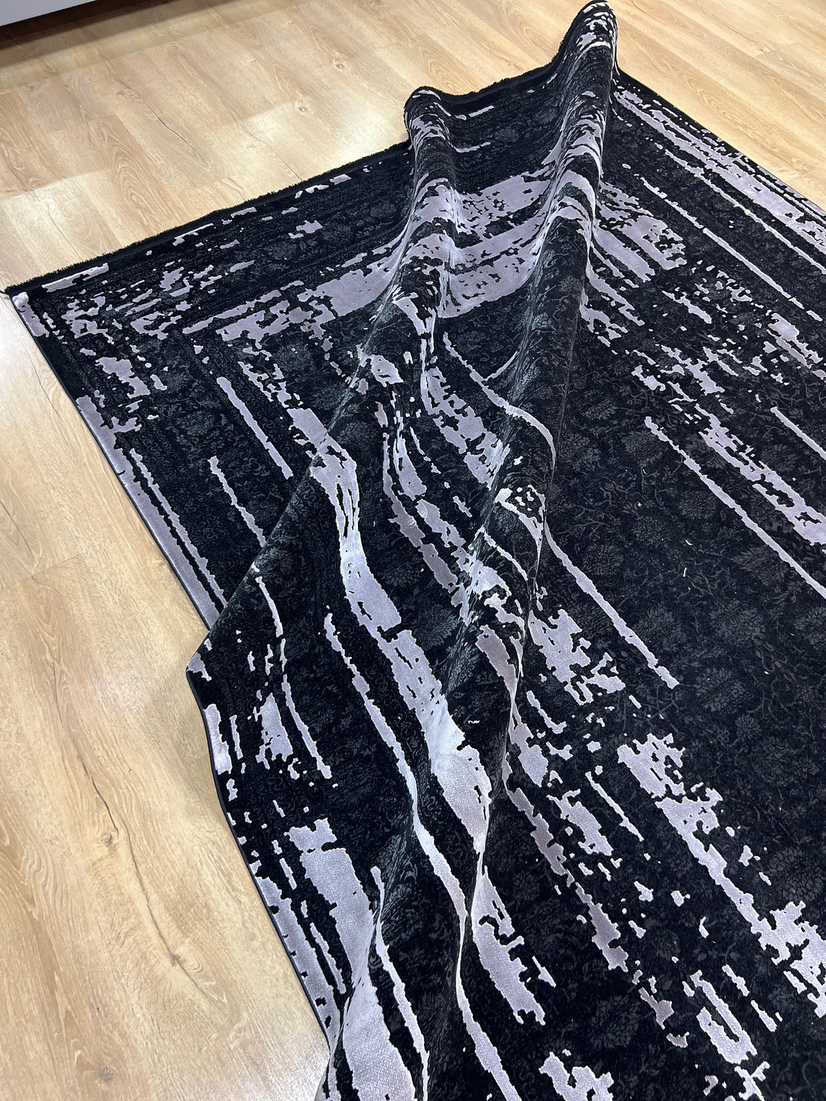 7x10 Ft Black Ethnic Distressed Bamboo Rug with Gray Modern Lines